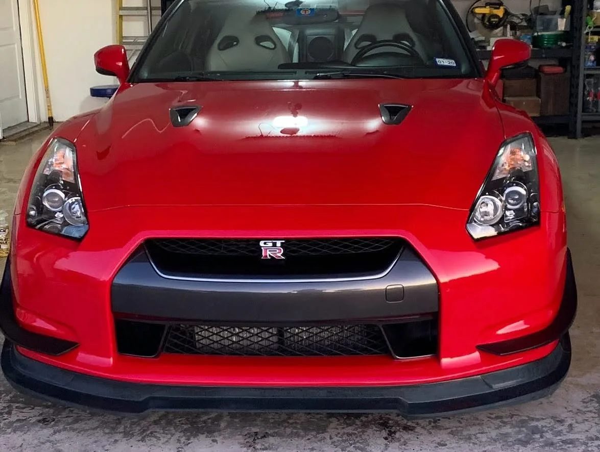 Red Nissan GT-R front end shining inside a garage