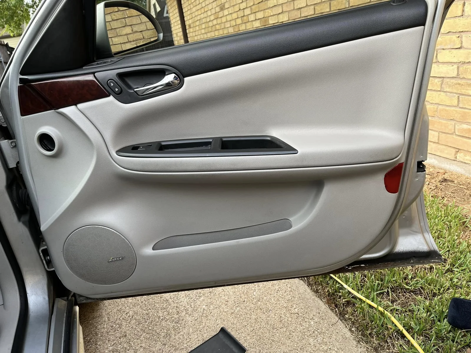 Freshly cleaned light gray luxury vehicle door panel