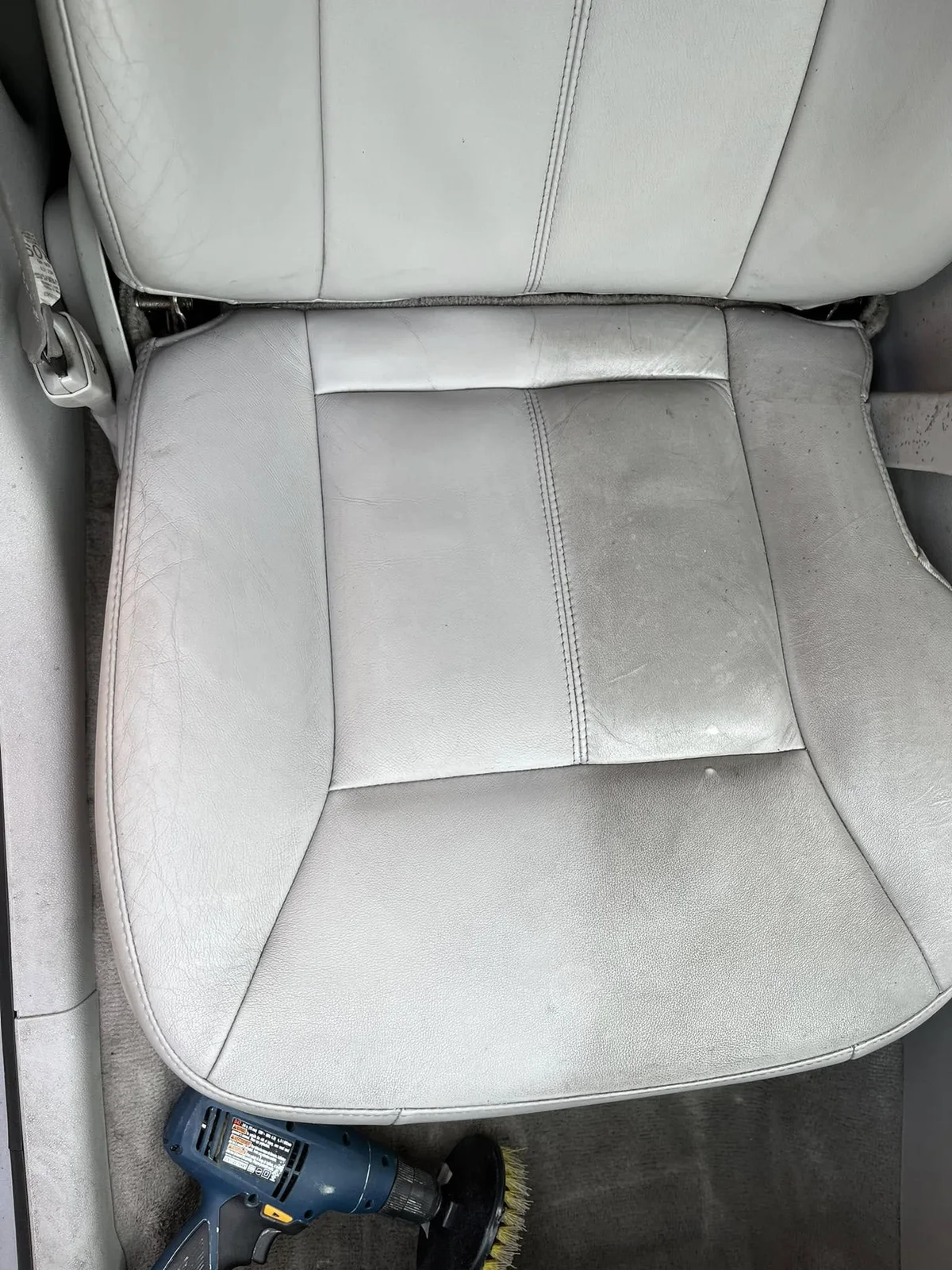 Light leather vehicle seat during a deep clean