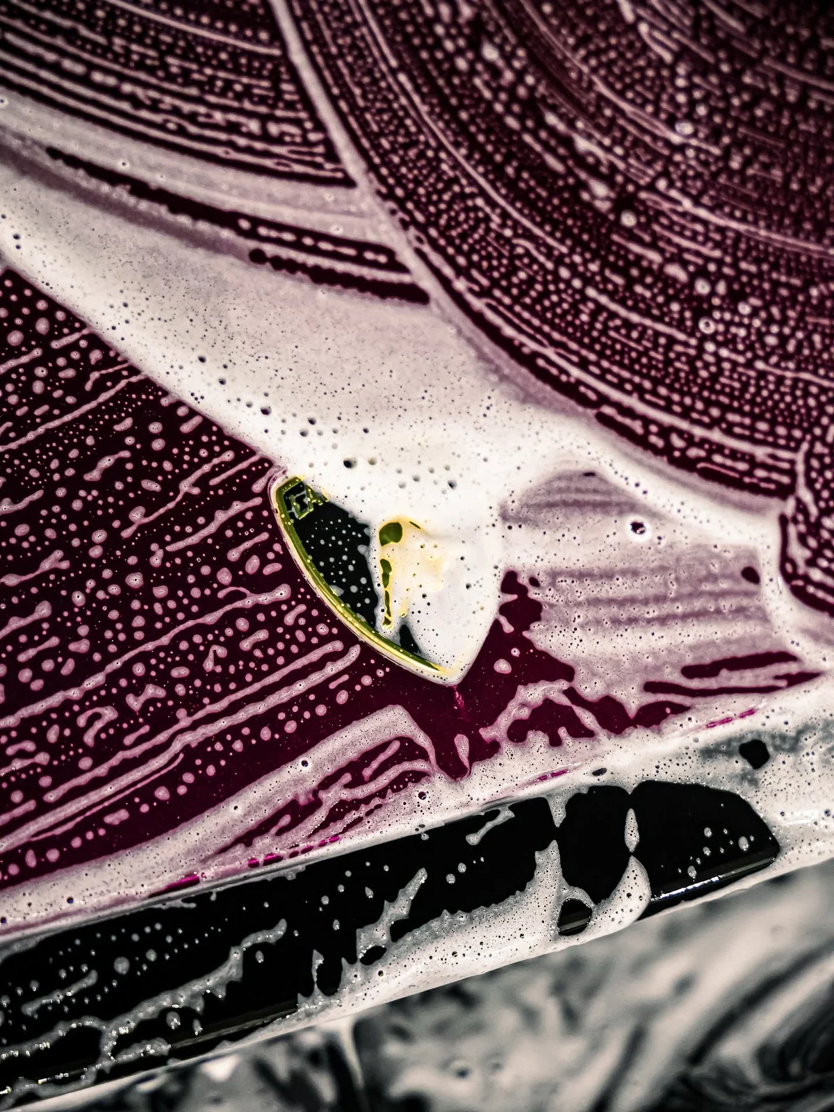 Lamborghini hood badge surrounded by dense wash foam